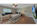 Spacious living room with large sectional sofa and TV at 277 E Windsor Ct, Gilbert, AZ 85296