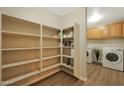Well-organized pantry offers ample shelving for food storage at 277 E Windsor Ct, Gilbert, AZ 85296