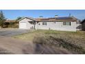 Front view of a single-story house with a grassy lawn at 3440 W Krall St, Phoenix, AZ 85017