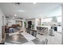 Modern kitchen with white cabinets and a large island at 3440 W Krall St, Phoenix, AZ 85017