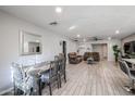 Open living and dining area with gray wood-look floors at 3440 W Krall St, Phoenix, AZ 85017