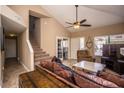 Bright and airy living room with high ceilings and a staircase at 4407 E Villa Theresa Dr, Phoenix, AZ 85032