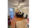 Casual dining area with wood flooring and access to patio at 4854 W Berkeley Rd, Phoenix, AZ 85035