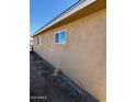 Side of house with window and yard at 4854 W Berkeley Rd, Phoenix, AZ 85035