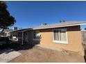 Tan house with front entrance and yard at 4854 W Berkeley Rd, Phoenix, AZ 85035