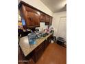 Kitchen boasts ample cabinet space and granite countertops at 4854 W Berkeley Rd, Phoenix, AZ 85035