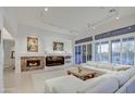 Spacious living room featuring a fireplace and large windows at 7462 E Visao Dr, Scottsdale, AZ 85266