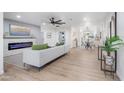 Bright living room with fireplace, hardwood floors, and open concept floor plan at 7749 E Coolidge St, Scottsdale, AZ 85251