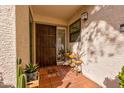 Front entry with decorative door and tiled flooring at 7800 E Lincoln Dr # 1096, Scottsdale, AZ 85250