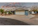 Two-car garage and nicely landscaped front yard at 10611 W Caron Dr, Sun City, AZ 85351