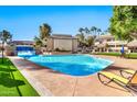 Stunning pool with waterfall and lounge chairs at 1331 W Baseline Rd # 316, Mesa, AZ 85202