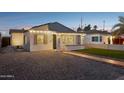 Charming bungalow with a brick driveway, walkway, and artificial turf at 1614 W Lynwood St, Phoenix, AZ 85007