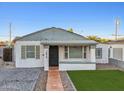 Recently updated home with artificial turf and new landscaping at 1614 W Lynwood St, Phoenix, AZ 85007