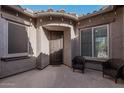 Inviting front patio with seating area and decorative lighting at 29317 N 20Th Ave, Phoenix, AZ 85085