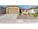New single-story home with a two-car garage and desert landscaping at 3244 W Cedar Ridge Rd, Phoenix, AZ 85083