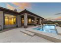 Inviting backyard oasis featuring a large pool and spa at 36549 N Porta Nuova Rd, Scottsdale, AZ 85262