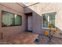 Front entry with tiled patio and metal door at 5440 S Clambake Bay Ct, Tempe, AZ 85283