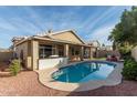 Inviting kidney-shaped pool with a spacious patio perfect for entertaining at 6823 W Williams Dr, Glendale, AZ 85310