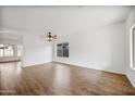 Bright living room with hardwood floors and ceiling fan at 826 E Bradstock Way, San Tan Valley, AZ 85140