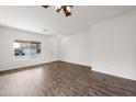 Light-filled living room with hardwood floors and a view at 826 E Bradstock Way, San Tan Valley, AZ 85140