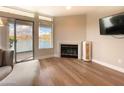 Living room with lake views and a cozy fireplace at 10080 E Mountain View Lake Dr # 140, Scottsdale, AZ 85258