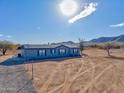 Mobile home with a large yard, mountain views, and ample outdoor space at 10991 W Hilltop Dr, Casa Grande, AZ 85193