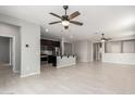 Open concept living area with a view into kitchen and hallway at 1154 W Lowell Dr, San Tan Valley, AZ 85140