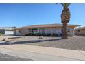 Brick ranch home with a two-car garage and desert landscaping at 12619 N Sun Valley Dr, Sun City, AZ 85351