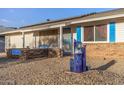 Front entrance with blue accents and a water fountain at 12630 W Crystal Lake Dr, Sun City West, AZ 85375