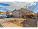 House exterior with driveway and front yard at 12907 W Sharon Dr, El Mirage, AZ 85335