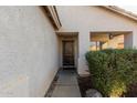 Front door entry with walkway and landscaping at 12907 W Sharon Dr, El Mirage, AZ 85335