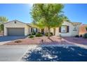 Single-story home with attractive landscaping and a two-car garage at 13105 W Micheltorena Dr, Sun City West, AZ 85375