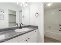 Updated bathroom with white vanity and a bathtub at 14203 N 19Th Ave # 1051, Phoenix, AZ 85023