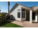 Front entry with brick walkway and a brown door at 1636 E Juanita Ave, Mesa, AZ 85204