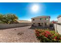 Spacious backyard with gravel and desert landscaping at 17840 W Calavar Rd, Surprise, AZ 85388