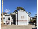 Single-wide manufactured home with carport and landscaping at 2273 S Seminole Dr, Apache Junction, AZ 85119