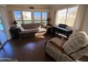 Bright living room with sofa, armchair, and piano at 2273 S Seminole Dr, Apache Junction, AZ 85119