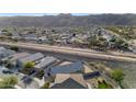 Aerial perspective of the house and neighborhood, near mountains at 2405 E Beverly Rd, Phoenix, AZ 85042