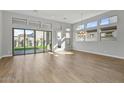 Bright dining room with wood-look floors and large windows at 26123 N 20Th Dr, Phoenix, AZ 85085