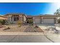 Single-story home with desert landscaping and two-car garage at 31847 N 53Rd St, Cave Creek, AZ 85331