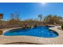 Inviting kidney-shaped pool with waterfall feature at 31847 N 53Rd St, Cave Creek, AZ 85331