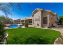 Relaxing backyard oasis with a sparkling pool and grassy area at 31847 N 53Rd St, Cave Creek, AZ 85331