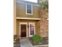 Tan two-story home with a red door and landscaping at 3329 W Mcrae Way # 4, Phoenix, AZ 85027