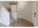 Bright and spacious entryway with a curved staircase and tile floors at 4615 E Bent Tree Dr, Cave Creek, AZ 85331