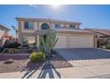 Two-story house with three-car garage and desert landscaping at 4615 E Bent Tree Dr, Cave Creek, AZ 85331