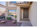 Inviting front entrance with a brown door and stone pathway at 4615 E Bent Tree Dr, Cave Creek, AZ 85331