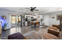 Open concept living room and kitchen with island at 4902 W Cypress St, Phoenix, AZ 85035