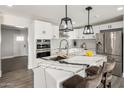 Renovated kitchen with island, modern cabinets, and stainless steel appliances at 538 N 74Th St, Scottsdale, AZ 85257