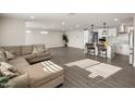 Open living room and kitchen with modern design and flooring at 538 N 74Th St, Scottsdale, AZ 85257