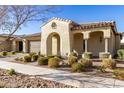 House exterior showcasing a Spanish-style home with lush landscaping at 5720 S Wildrose --, Mesa, AZ 85212